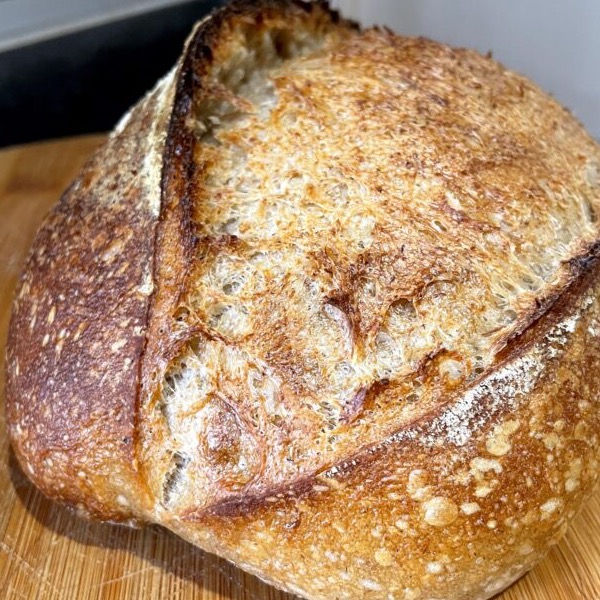 A loaf of homemade sourdough bread.